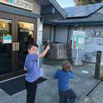 Manchester Library patron Bridger Secor (left) and his younger brother Clymer Secor participate in the solar scavenger hunt at the facility. (courtesy photo)
