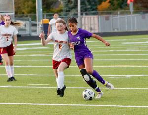 Kamora McMillian tries to step past Kingstons Cora Caldis. McMillian is a team captain and one of just five seniors on North Kitsaps girls soccer team this year. (Mark Krulish/Kitsap News Group)