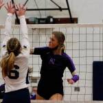 North Kitsaps Maddie Pryde tips a shot past two Bainbridge defenders. The Vikings defeated the Spartans on Tuesday night to split their season series and share the top spot in the Olympic League. (Mark Krulish/Kitsap News Group)