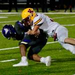 Kingstons Camden Singer shoots through the line to make a tackle in the backfield against North Kitsap. (Mark Krulish/Kitsap News Group)