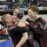 South Kitsap wrestler Xavier Eaglin gets a hug from head coach Chad Nass as he won his first-ever state championship, which contributed to the Wolves winning the overall 4A team title. (File photo)