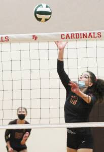Marion Stejer, a Kingston senior, dinks the ball for a point against Lindbergh. Steve Powell/Kingston Community News photos
