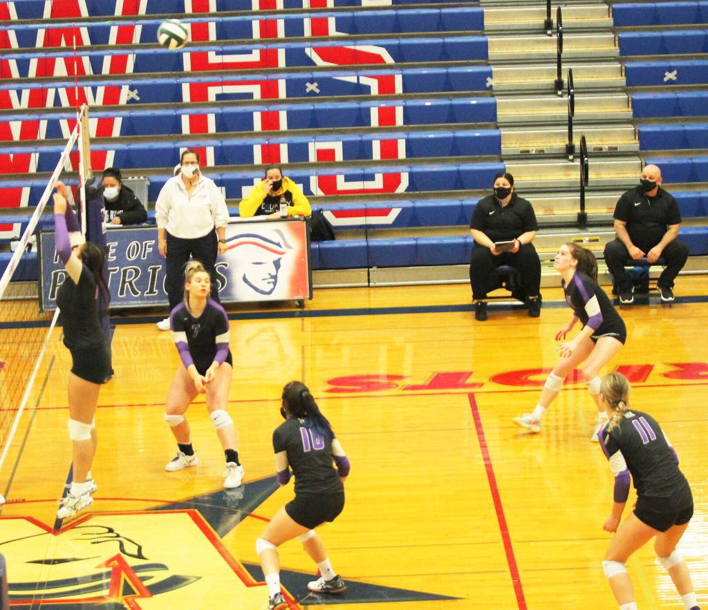 A birds-eye view shows North Kitsap getting into position as the ball comes over the net.