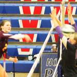 Two Viking blockers get smacked by a spike against White River.