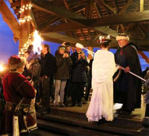 The Santa Lucia bride prepares to light the ceremonial bonfire at the 2019 Poulsbo Julefest. Herald file photos