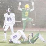 Logan Sloman (8) is tackled after making a catch as Ethan Guerra (88) watches.
