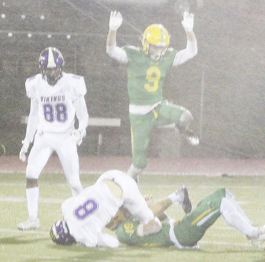 Logan Sloman (8) is tackled after making a catch as Ethan Guerra (88) watches.