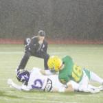Viking Lincoln Castillo (12) is tackled to the ground as the incomplete pass flies by.