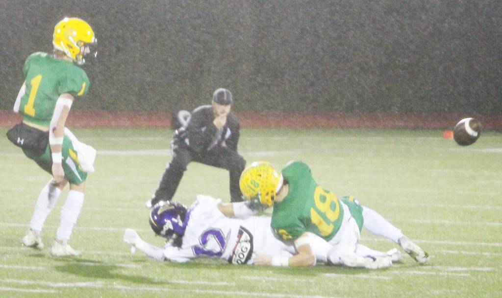 Viking Lincoln Castillo (12) is tackled to the ground as the incomplete pass flies by.