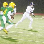 Zeke Harris (4) and Morgan Paul (3) of North Kitsap try to chase down Lynden wide receiver Kaleo Jandoc in Saturdays game.