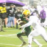 Zeke Harris (4) and Colton Bower (2) try to tackle Lion quarterback Kaeden Hermanuitz (15), but he scored anyway.