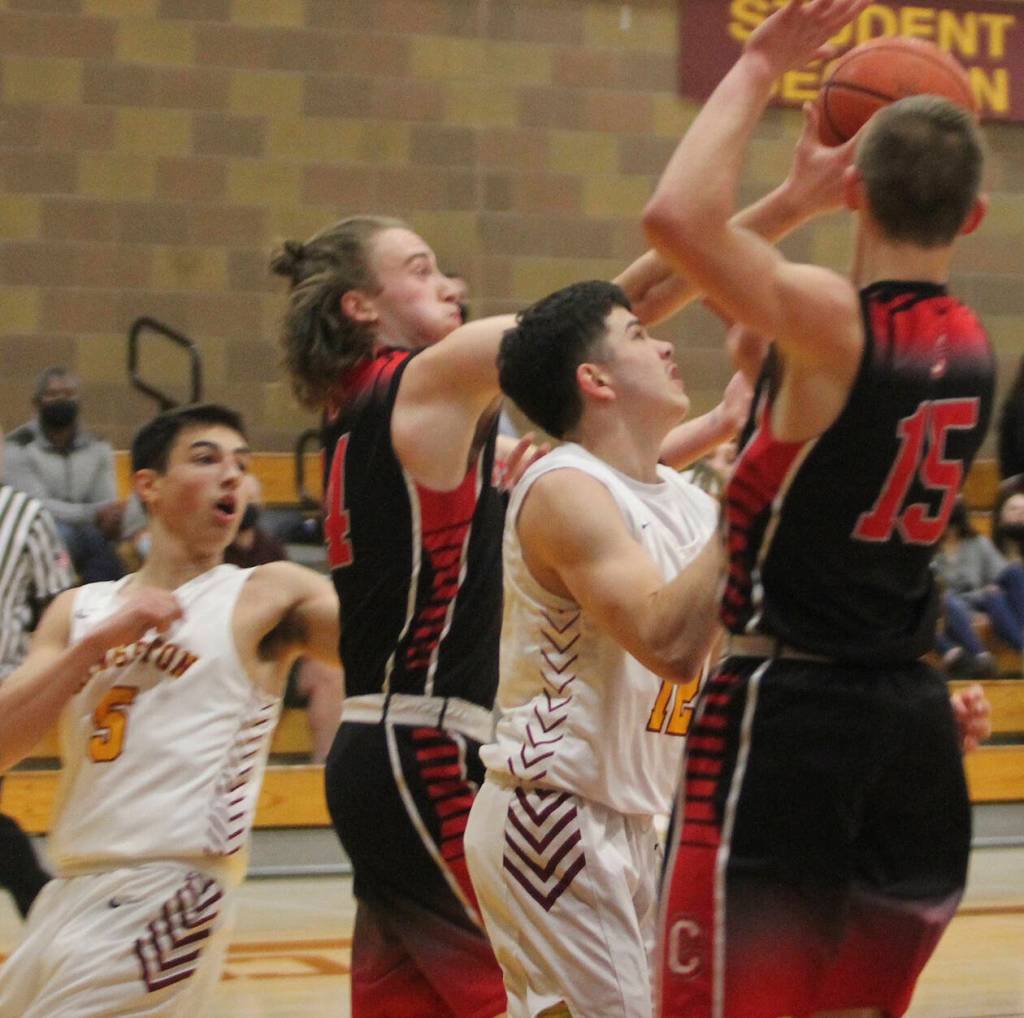 Kingstons Dakota Standley is sandwiched by two Crosspoint defenders in the Bucs win.