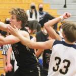 Colton Bower of North Kitsap and Caleb Durrance (33) of BI go after a rebound.
