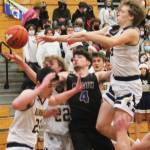 Jonas La Tour (4) of North Kitsap is surrounded by Spartans as he reaches for the ball.