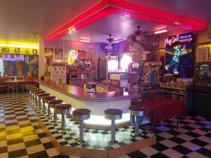 Neon lights and signs gives My Girl a 1950s feel, along with all the other collectibles from that time period.