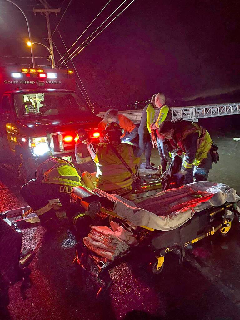 Crew members from South Kitsap Fire and Rescue come to the aid of a driver whose vehicle left the Southworth Drive roadway and entered the frigid waters of Puget Sound. The driver was taken to St. Anthony Hospital in Gig Harbor, according to SKFR officials. (SKFR photos)