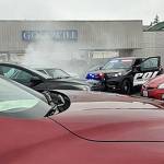 A stolen car with a suspect inside attempts to break free from being pinned in by Port Orchard police officers. (Courtesy video still)