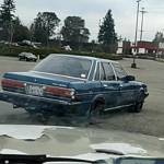 A stolen vehicle with a suspect behind the wheel eludes Port Orchard police officers from the parking lot in front of Goodwill on Mile Hill Drive. (Courtesy video still)