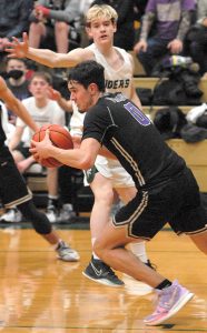 North Kitsaps Johny Olmsted (0) gets the Viking fastbreak started against Port Angeles Thursday night. PA, however, was able to slow down NK to get the win. Keith Thorpe/For the Herald
