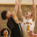 Buc Caden Krantz (2) goes up for a layup against North Kitsaps Cade Orness (10). The Kingston boys had a home playoff game Feb. 16, after deadline. Steve Powell/File photo
