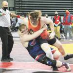 Gavin Garner of Kingston and Treavor Atkins of Lindbergh kind of throw each other down in an effort to gain control of the match.