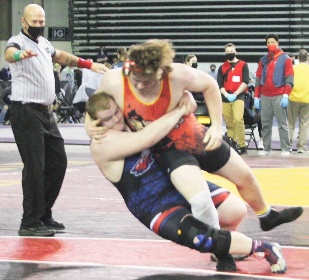 Gavin Garner of Kingston and Treavor Atkins of Lindbergh kind of throw each other down in an effort to gain control of the match.