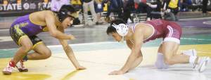 Steve Powell | Kitsap News Group
Mitchell Neiner, right, of South Kitsap was the state champion at 126 pounds, shown here wresting Miguel Valdez of Sunnyside.