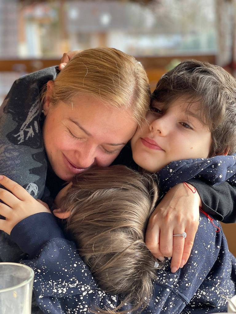 A moment of relief and shared hugs for the Kusherets family after arriving in France. (Courtesy of Daria Kusherets)