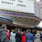 Bremerton community leaders and boosters of the Quincy Square Project revitalization effort gather on Wednesday to hear U.S. Rep. Derek Kilmer address the crowd in front of the Historic Roxy Theatre, which will front the new development. Kilmer helped secure $2.5 million from Congress for the effort. (Bob Smith | Kitsap News Group)