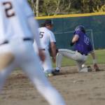 North Kitsaps Caleb Callahan slides safely into second base against Bainbridge as Connor Sweeny of BHS lays down the tag.