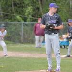 Viking sophomore pitcher Noah Sorenson (11) works from the stretch with a runner at first.