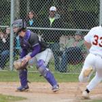 Kingston sophomore Peau Tameilau (33) slides safety into home plate as catcher Colton Bower of North Kitsap awaits the throw. Steve Powell/North Kitsap Herald photos