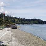 The waterfront at Kiana Lodge features a dock and the log (left) that was used in the filming of the TV series Twin Peaks.
