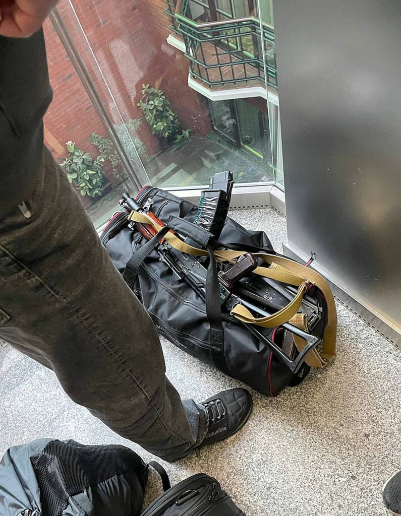 Signaling that Ukraine is in a state of war, an elevator passenger carries a rifle. (Courtesy photo)