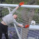 Looks are deceiving as NK goalie Trevor Dill actually tipped the soccer ball over the bar to keep Clover Park from scoring.