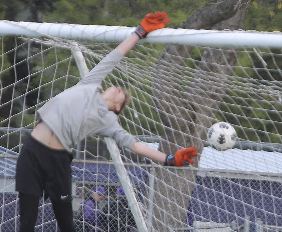 Looks are deceiving as NK goalie Trevor Dill actually tipped the soccer ball over the bar to keep Clover Park from scoring.