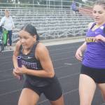 Viking Jasmine Gibson takes off after receiving the handoff from Emerson Bollert during a relay at a recent track meet.