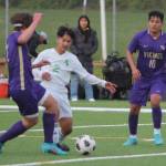 Jonathan Mendoza (10) of NK moves in to try to take the ball away from Clover Park.