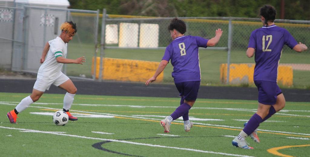NK's Angel Chavez (8), a junior forward, and Jackson Reeves (12) rush back to defend to keep Clover Park from scoring a breakaway goal. Steve Powell/North Kitsap Herald photos