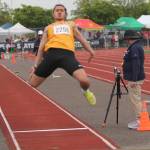 Viking Lincoln Castillo competes in the long jump at state.