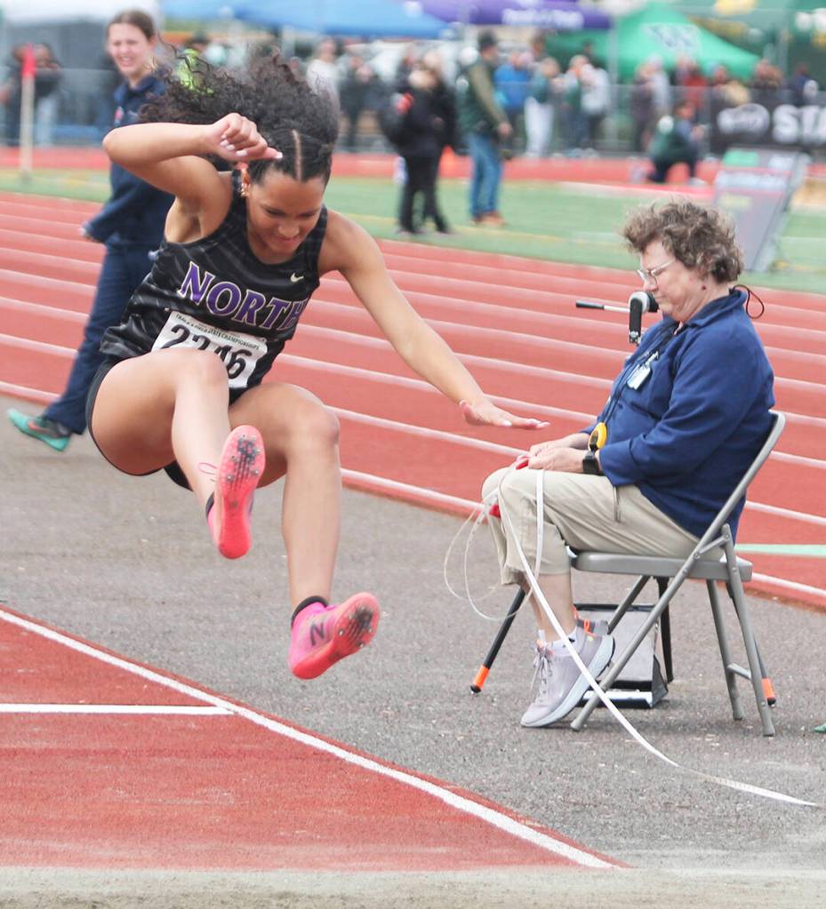 Jasmine Gibson leaps in the long jump at state.