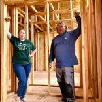 Breanna Littrell, marketing and outreach specialist with Housing Kitsap (left), and site supervisor Chris Evertz assist homeowners through the process of entering the Mutual Self-Help Housing program. (Bob Smith | Kitsap News Group)