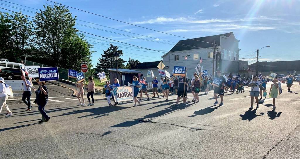 Supporters of political candidates gather together to march in the Fathoms O Fun Grand Parade in Port Orchard on June 25. (Bob Smith | Kitsap News Group)
