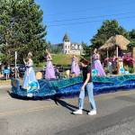 The Fathoms O Fun Royalty Court rides atop the festivals float on Saturday. (Bob Smith | Kitsap News Group)