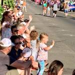 Parade watchers enjoy the warm weather while viewing the Fathoms O Funs Grand Parade on Saturday. (Bob Smith | Kitsap News Group)