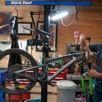 Night Owl Cycling founder Kelly Campo works on a bike in the shop. Tyler Shuey/North Kitsap Herald Photos