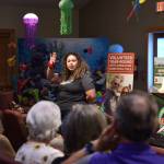 Miranda shares her shoebox story with Operation Christmas Child volunteers gathered at Calvary Chapel Church.