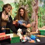 Lillian Kirtley and Veronica Miranda pack a shoebox for Operation Christmas Child at Calvary Chapel Church in Poulsbo. Nancy Treder/Kitsap News Group Photos