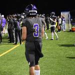 Beau Pahrmann warms up on the sideline before taking his turn on the field.