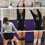 Central Kitsap's Kawehi Sarono blocks North Kitsap's Mackenzie Phillips kill attempt.